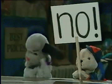 Scampi holds Sign saying "No!"
